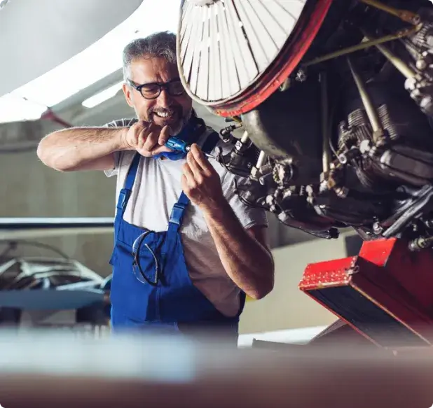 Mechanic in blue overalls